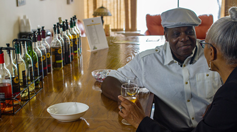 a couple at a bar drinking and talking
